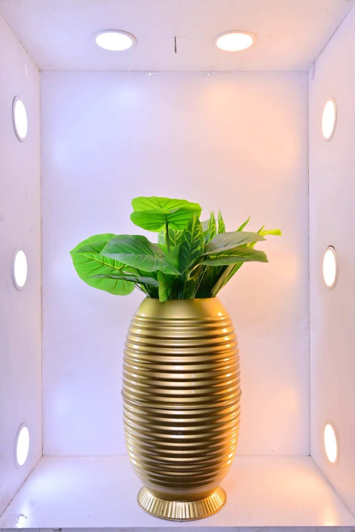 Shop the Cylindrical Metallic Ribbed Planter - 21 Inch, perfect for modern decor and plant displays. Add style and elegance to your home with ArtaFlora.com.