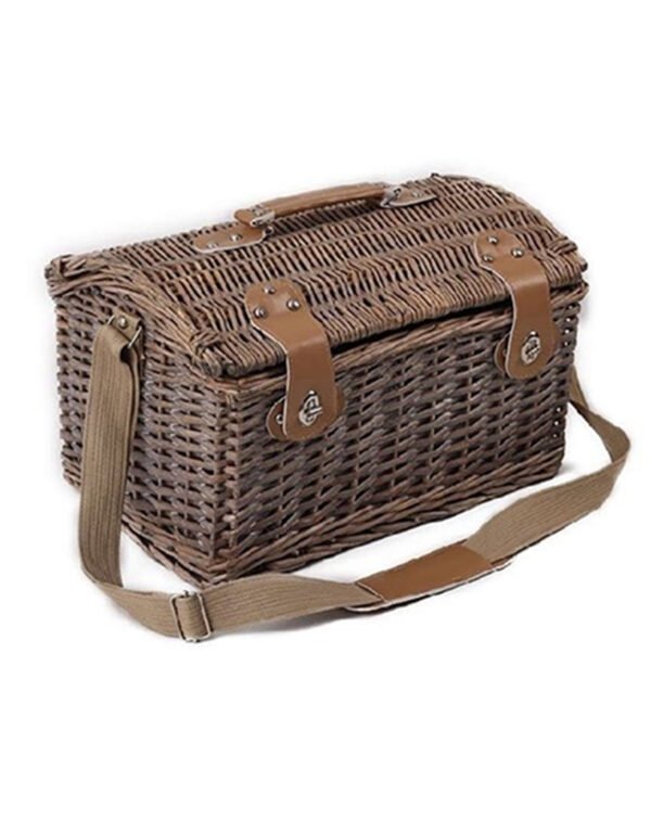 Vintage wicker picnic basket with shoulder strap and leather accents.