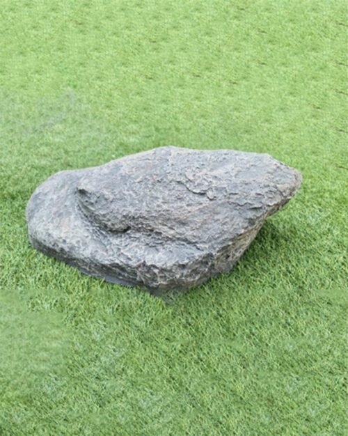 Unique Jumpy Rock Shape: Crafted to replicate the natural asymmetry found in genuine stones, adding authenticity and organic movement to your space. Intriguing Texture and Weathered Appearance: The hand-finished texture enhances visual depth and makes it almost indistinguishable from real stone. Natural Drama for Outdoor Spaces: Create instant visual interest and structure in gardens, lawns, ponds, and landscapes. Versatile Landscaping Applications: Whether placed beside water features, nestled among plants, or highlighted as a garden centerpiece, the Crown Rock adapts beautifully to any setting. Hand-Selected Quality: Every Crown Rock is quality-checked to ensure it meets Artaflora’s high standards for design and durability