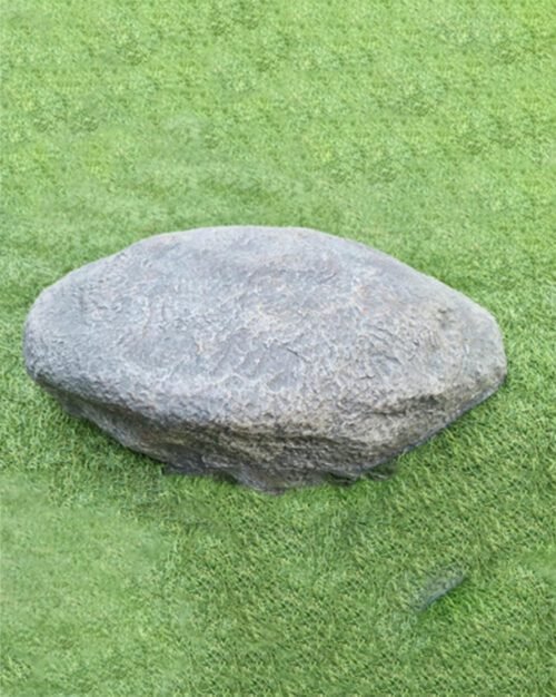 Indigo Rock Dimensions artificial stone placed in a garden bed
