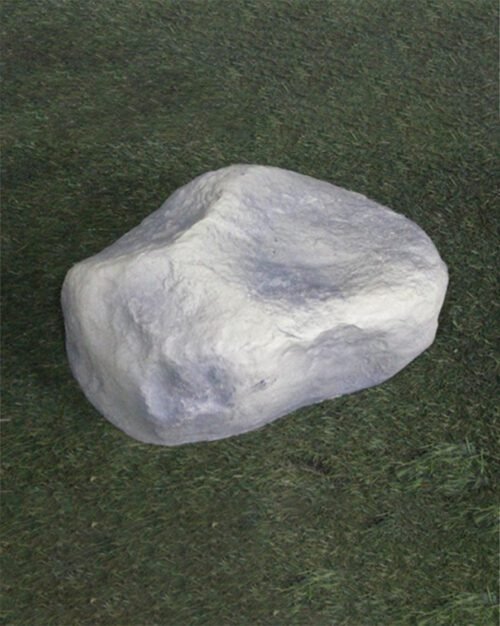 Decorative garden rock placed in flower bed