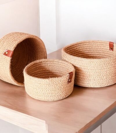 Tall oval jute rope laundry hamper for dirty clothes. Woven storage basket with sturdy handles, ideal for home organization. Size: 14×18 inch.