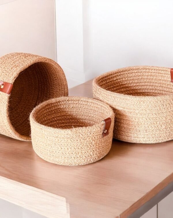 Tall oval jute rope laundry hamper for dirty clothes. Woven storage basket with sturdy handles, ideal for home organization. Size: 14×18 inch.