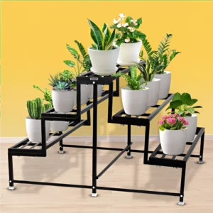 Black multi-tier metal plant stand holding a variety of potted artificial plants, placed against a yellow wall on a wooden floor.